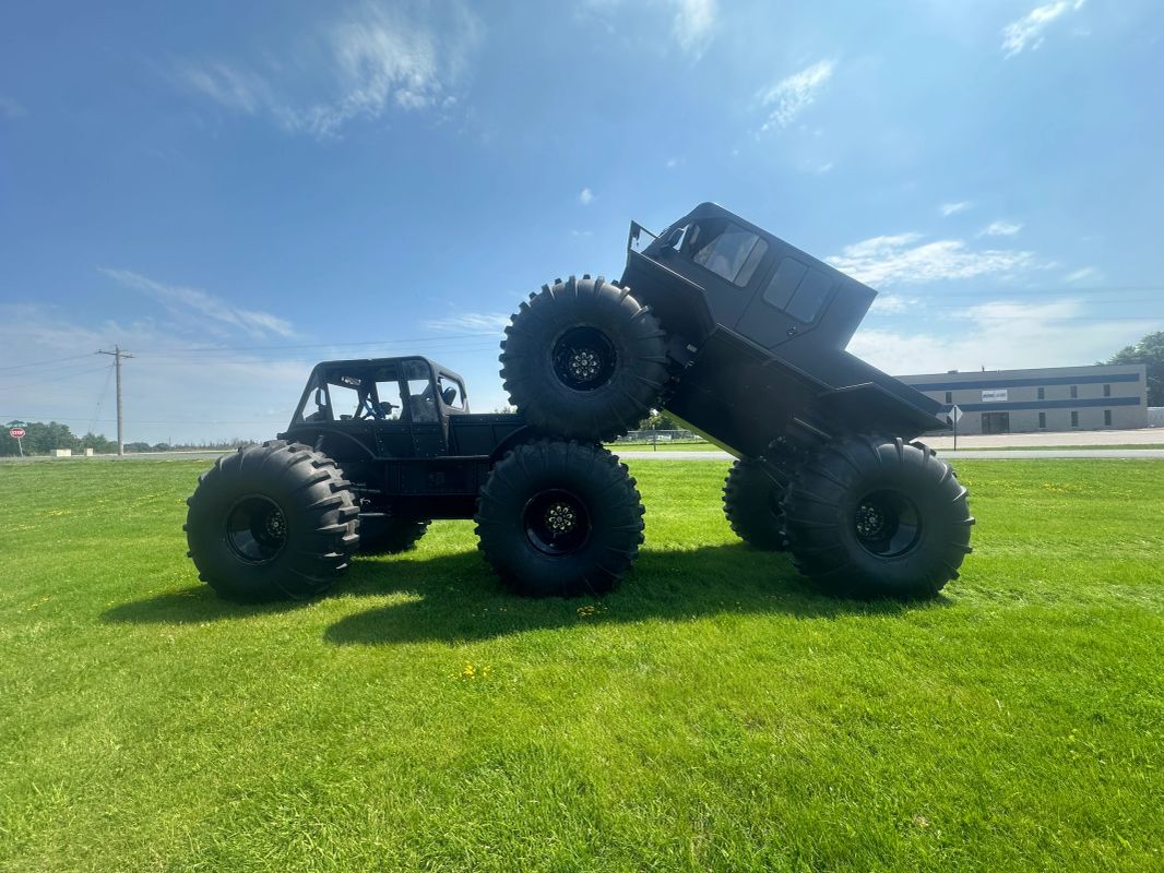 Two TUT 6x6 utility trucks demonstrating their articulation
