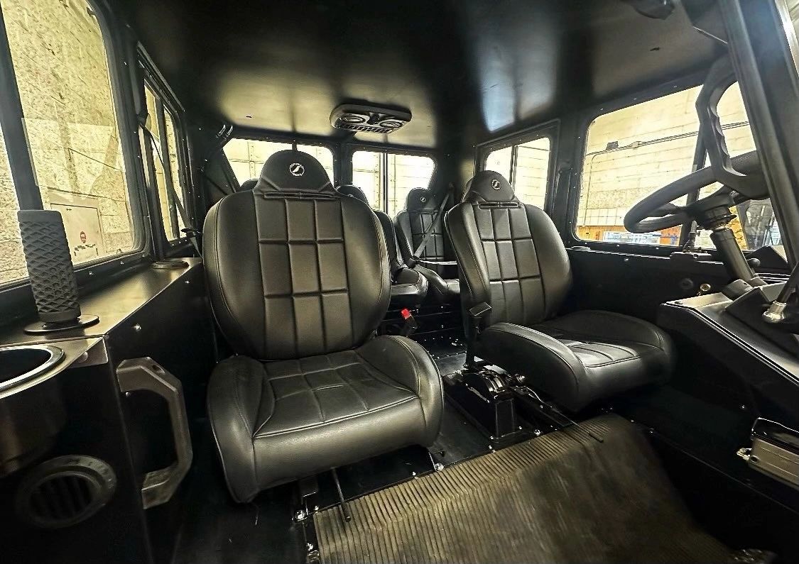 Five-seat interior of a TUT Titan utility truck
