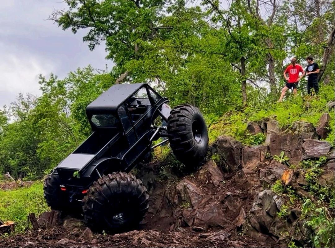 TUT utility truck climbing steep rocky terrain